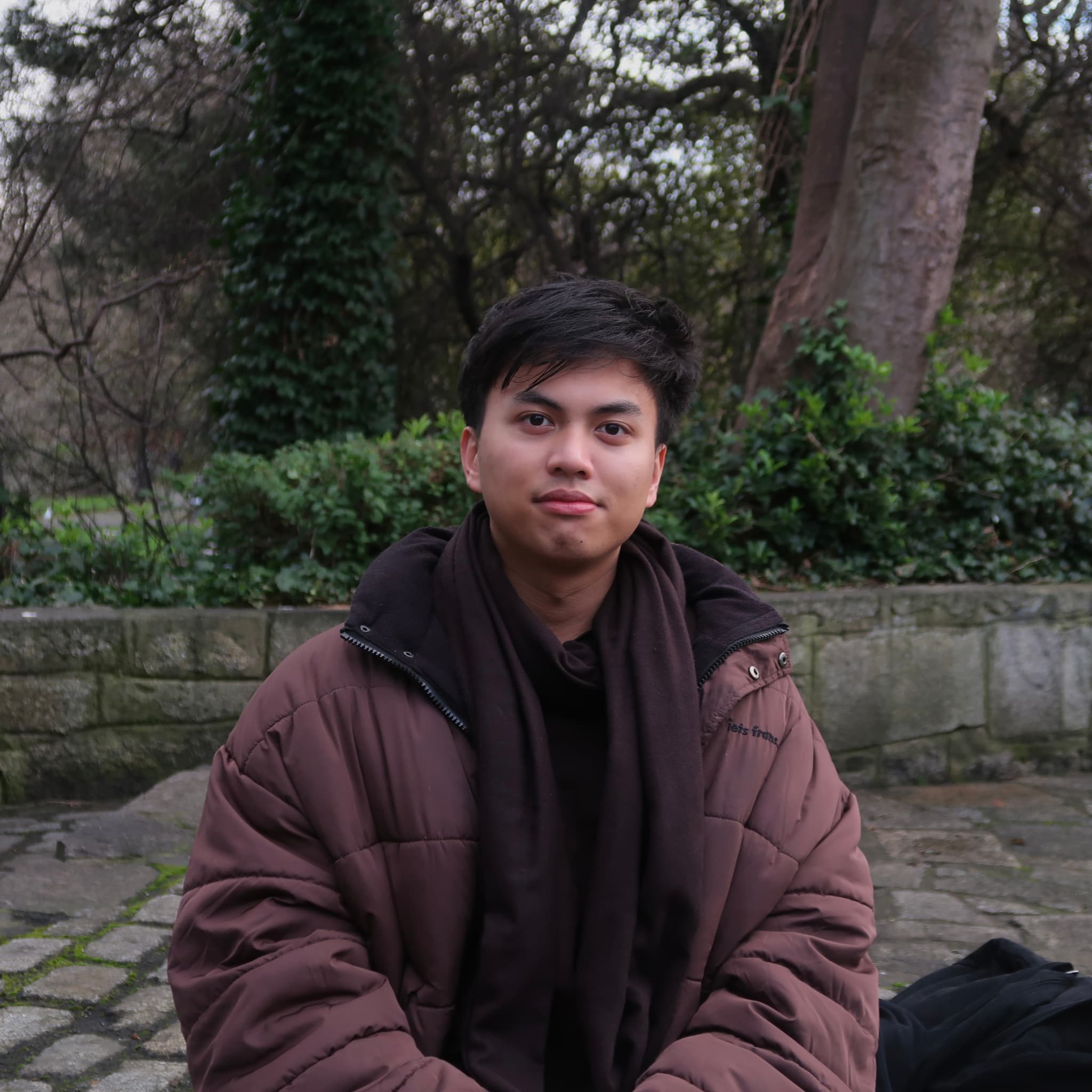 kenneth sitting down in an outside environment